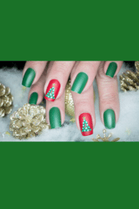 Festive Christmas nails with glittery red and green polish, adorned with miniature and sparkling ornaments